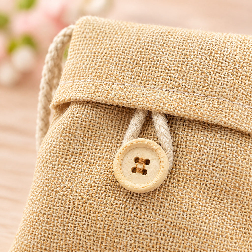 RosyIron bamboo charcoal bag close-up of the wooden button, braided cord loop and linen-look weave