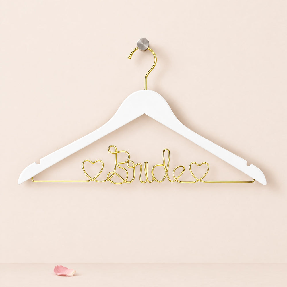 RosyIron Bride wedding dress hanger in white with gold wire Bride lettering and two hearts on a wall peg