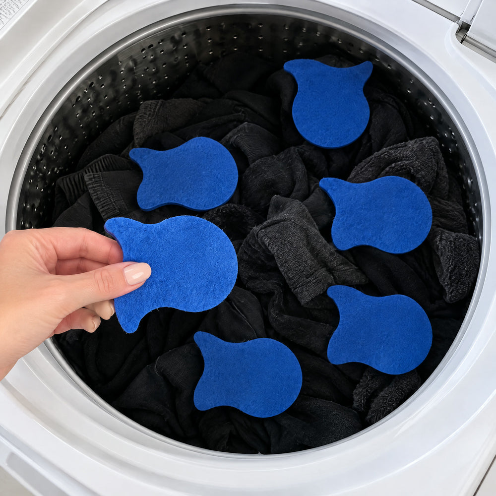 RosyIron pet hair fish being dropped into a top-load washer full of dark clothes