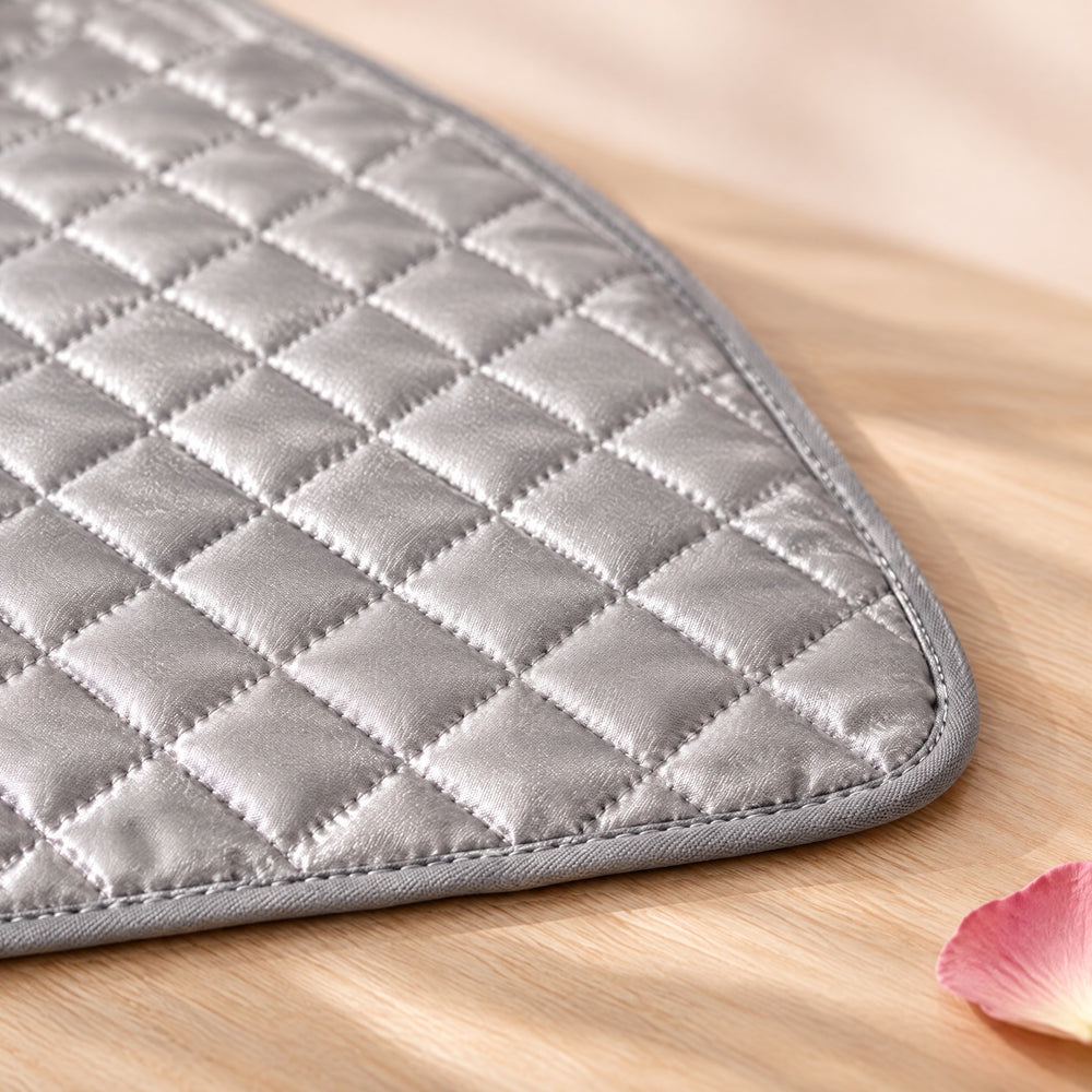 RosyIron ironing mat close-up showing padded diamond quilting, stitching and the grey bound edge