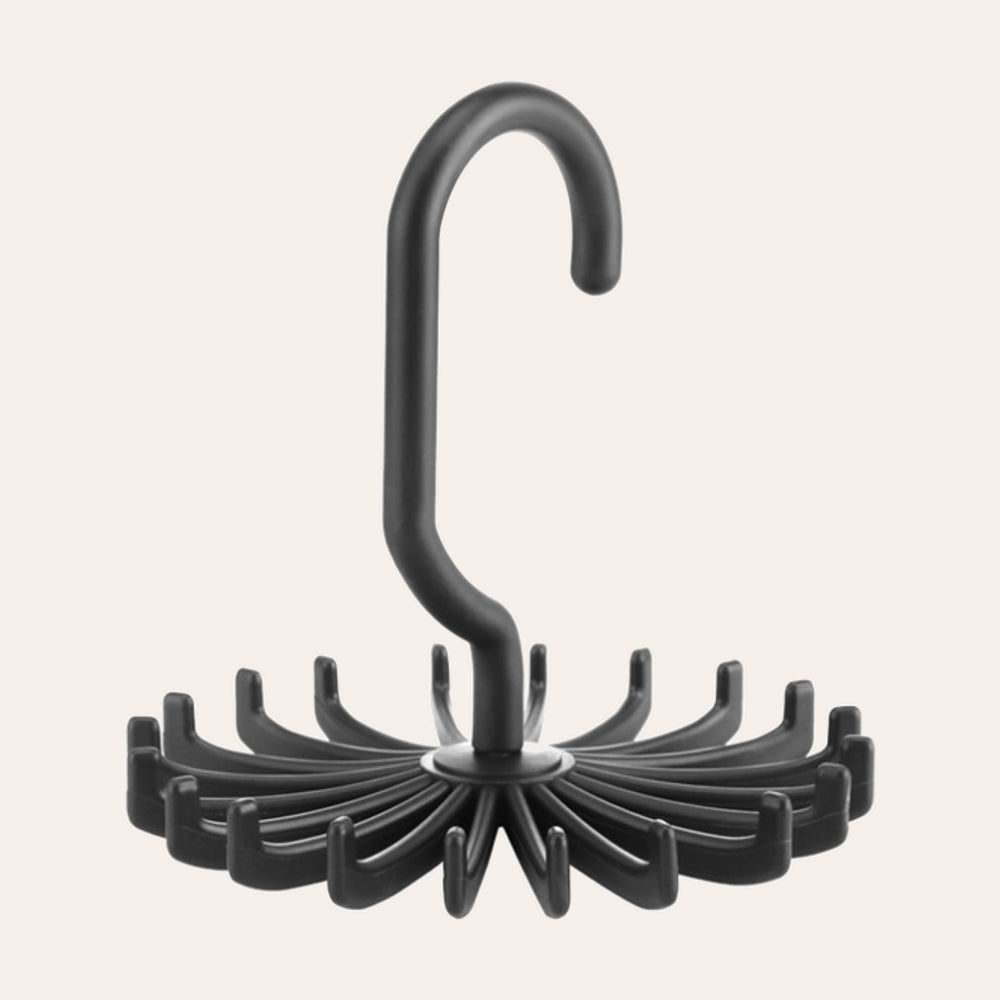 RosyIron rotating belt and scarf hanger in black with a ring of 20 hooks on blush background