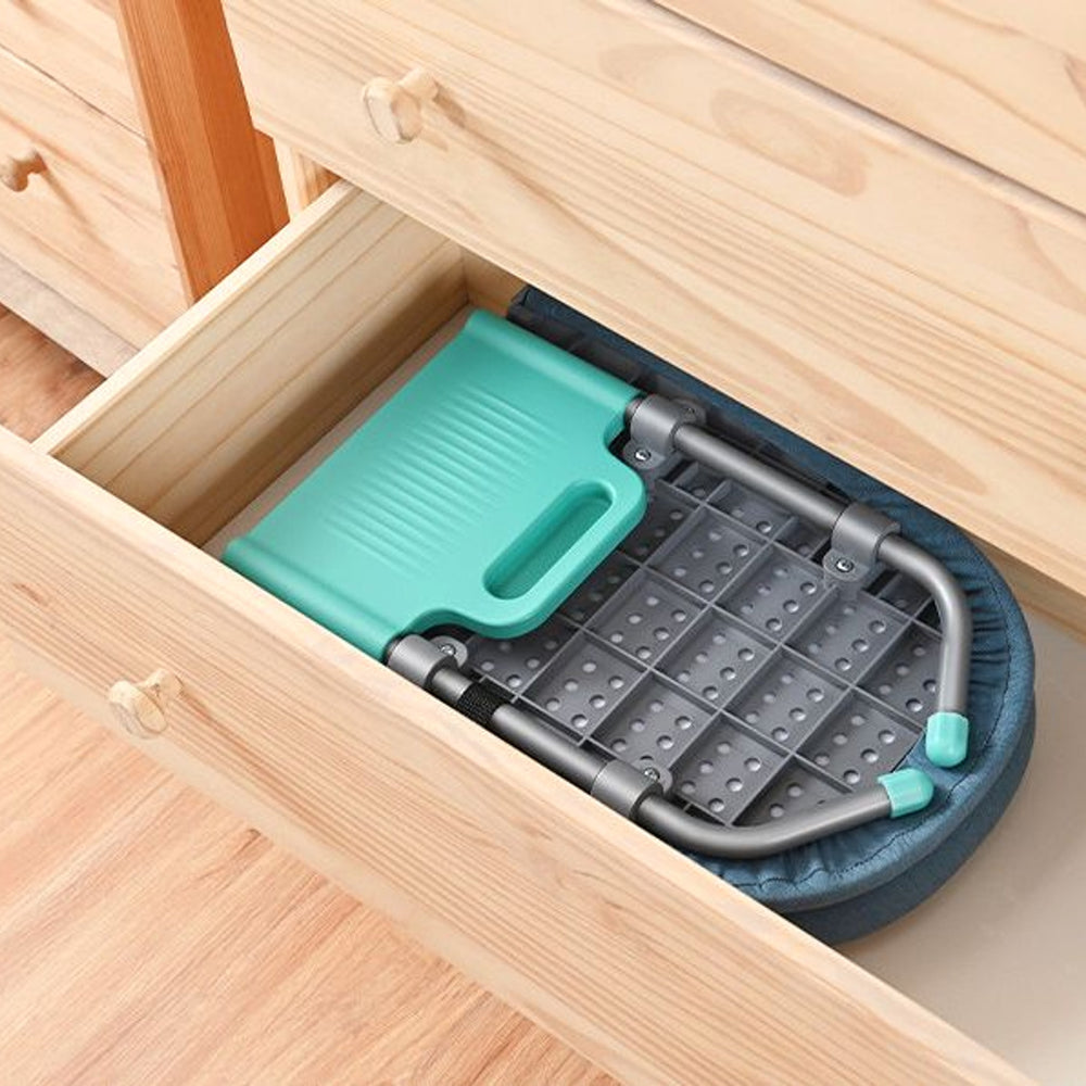 RosyIron tabletop ironing board folded in half and stored inside a wooden dresser drawer