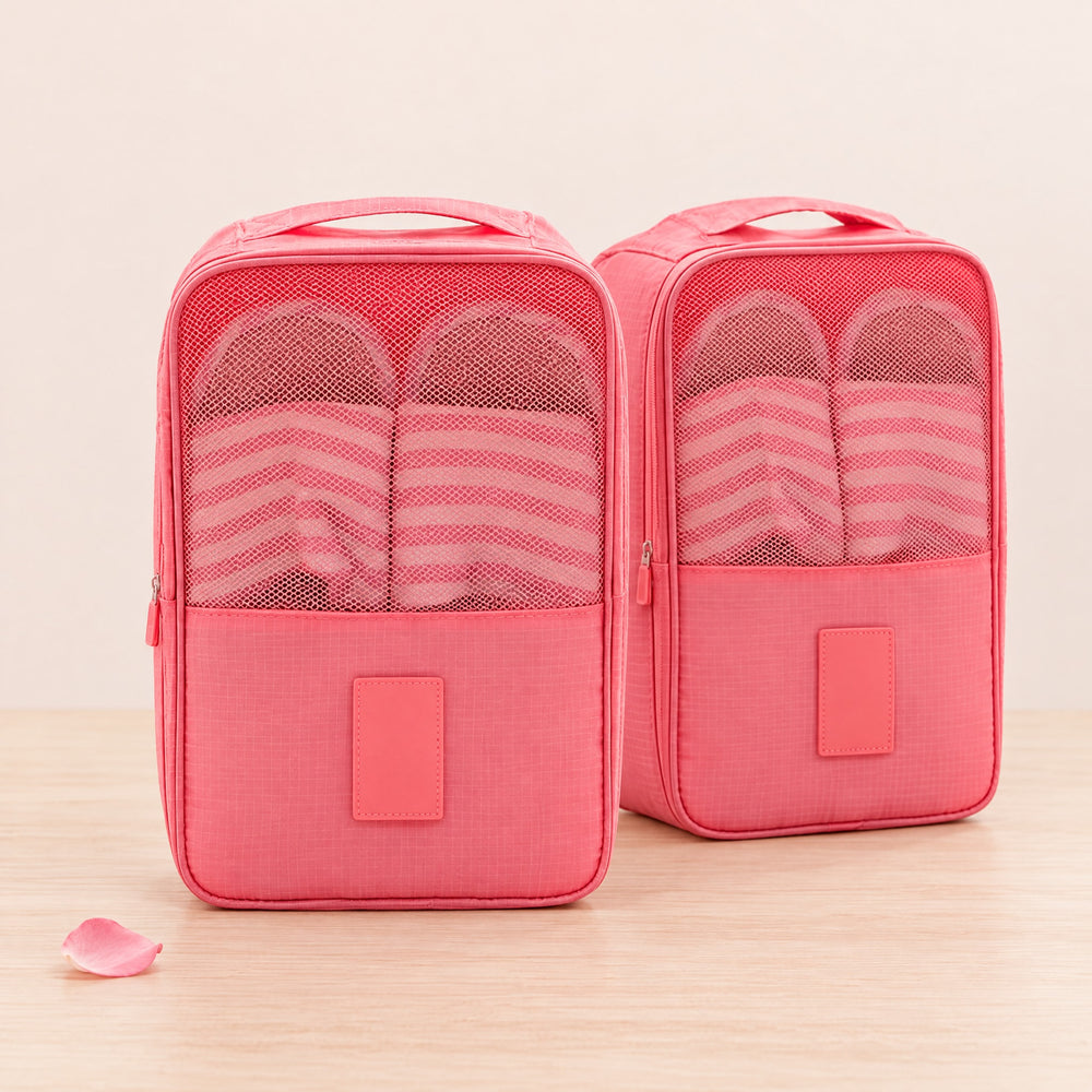 RosyIron set of two pink travel shoe bags with mesh windows standing on a light wood surface