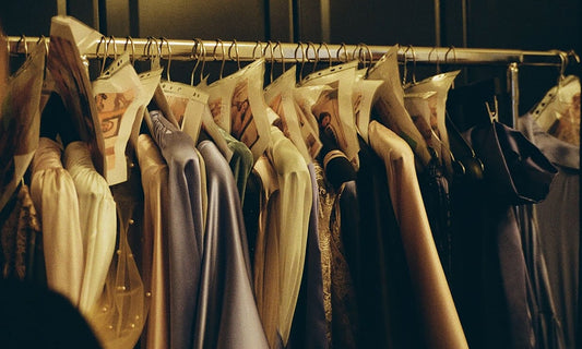 Silk and satin dresses hanging on a clothes rail