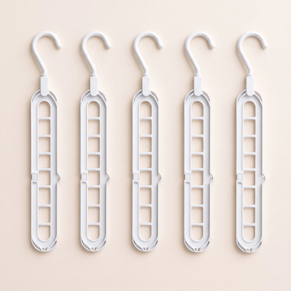 RosyIron 5-piece space-saving hanger set, five white closet hangers laid flat