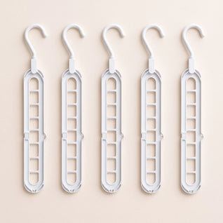 RosyIron 5-piece space-saving hanger set, five white closet hangers laid flat