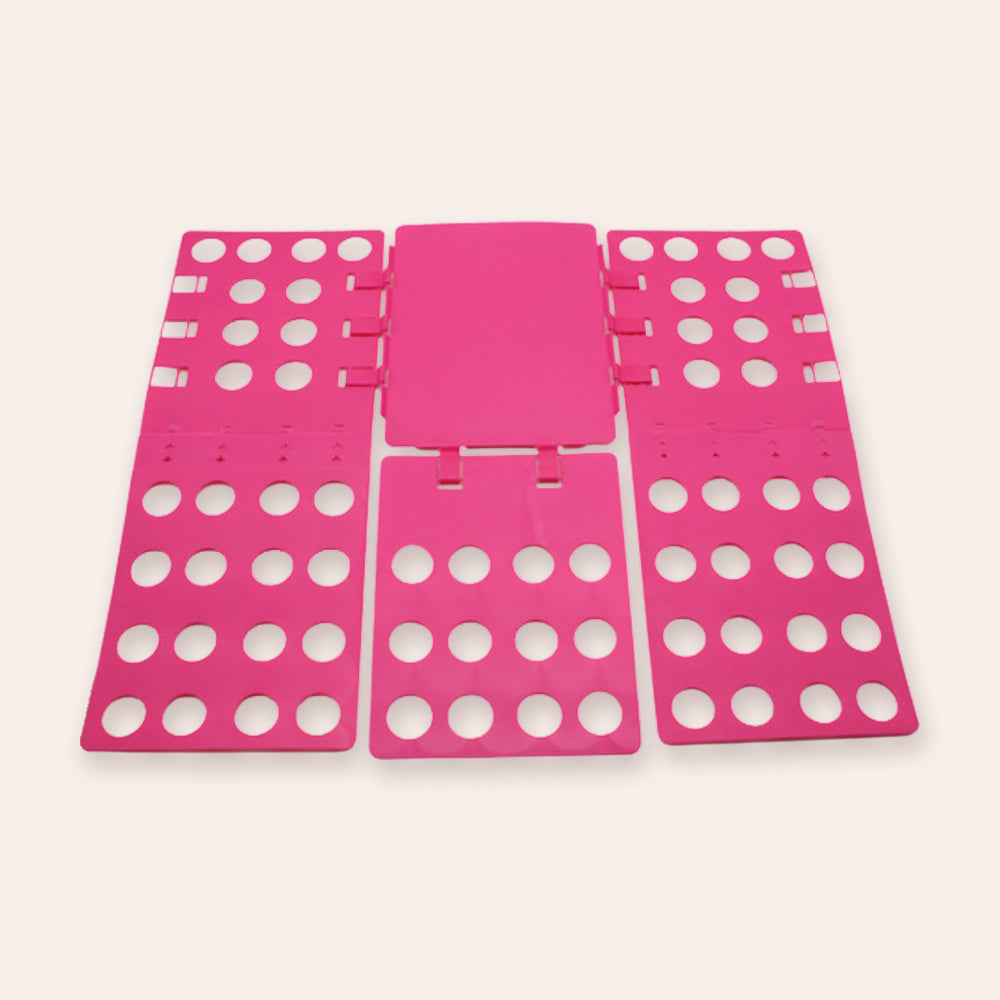 RosyIron adjustable clothes folding board in rose, opened flat with panels extended on a blush background
