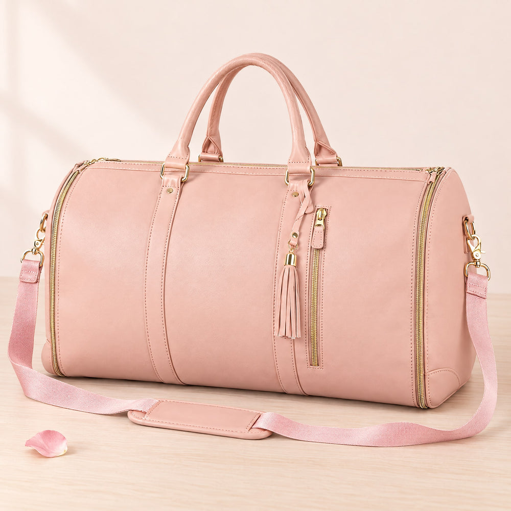 RosyIron convertible garment duffel bag in blush pink PU with gold zips, tassel and shoulder strap