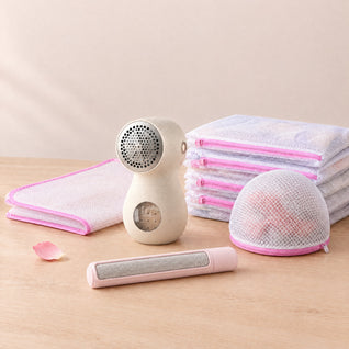 RosyIron Fabric Care Kit with fabric shaver, pink lint brush, mesh laundry bags and mesh pressing cloth