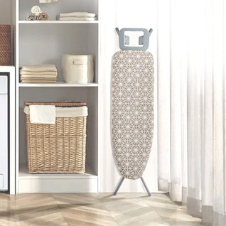 RosyIron full-size ironing board folded upright beside laundry room shelves and a wicker basket