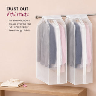 RosyIron garment dust covers protecting suit jackets and dress shirts on a wall rail above an oak bench