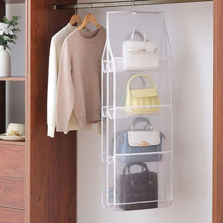 RosyIron clear hanging handbag organizer on a closet rod beside sweaters, four bags stored upright