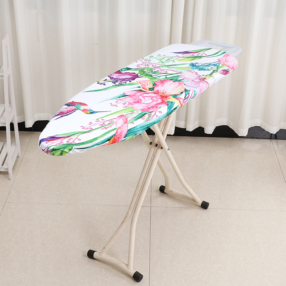 RosyIron floral ironing board cover with pink irises and a hummingbird fitted on an ironing board