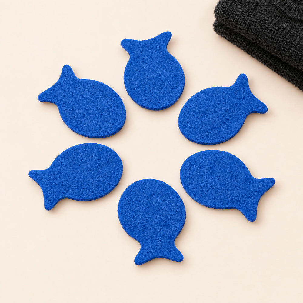 RosyIron laundry pet hair fish, six reusable blue fish-shaped hair catchers on a cream background