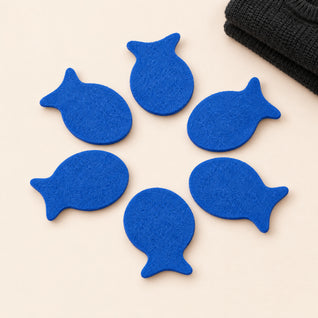 RosyIron laundry pet hair fish, six reusable blue fish-shaped hair catchers on a cream background