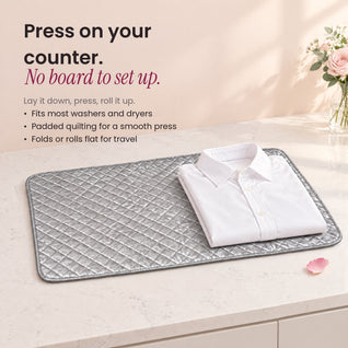 RosyIron magnetic ironing mat on a table with a folded white shirt, turning it into a pressing surface