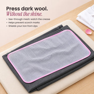 RosyIron mesh pressing cloth laid on grey wool trousers on a pressing pad, helping prevent shine when ironing