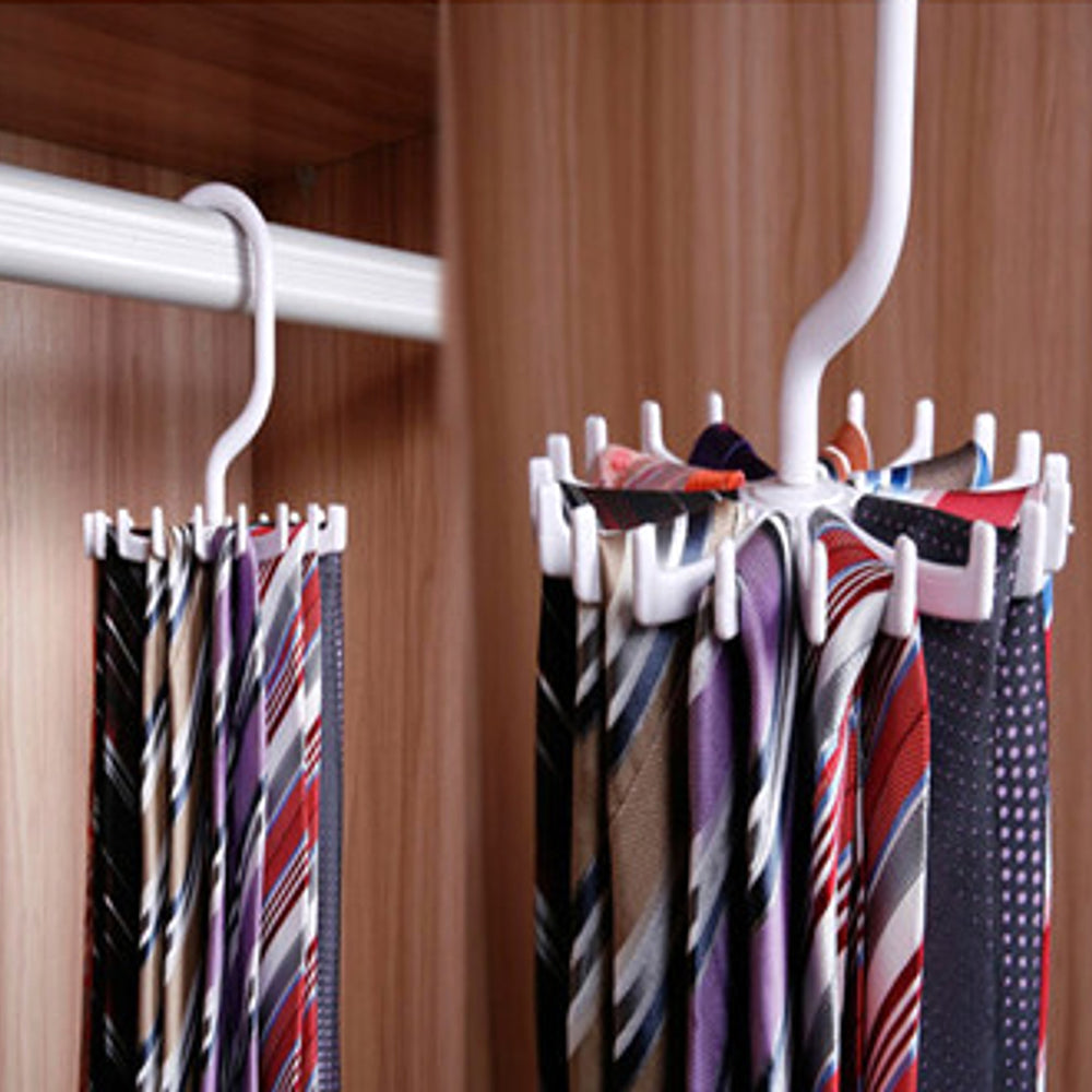 RosyIron rotating hangers in white holding neckties on a wooden closet rod