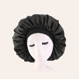 RosyIron satin sleep bonnet in black with a wide stretch band, shown on a display head
