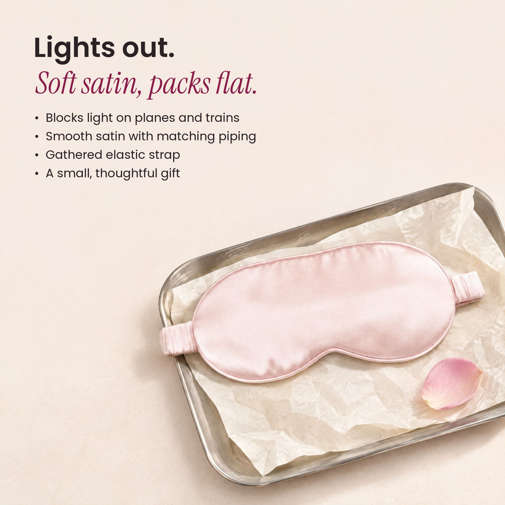 RosyIron satin sleep mask on a silver tray with tissue paper and a rose petal, a soft travel gift
