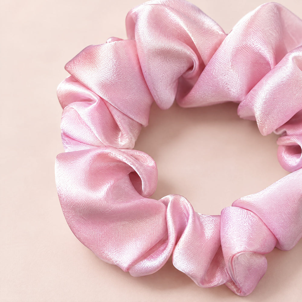 RosyIron pink scrunchie close-up showing the smooth satin-look sheen and soft gathered folds