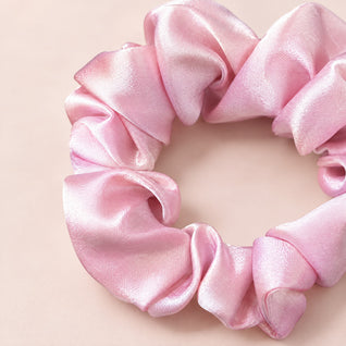 RosyIron pink scrunchie close-up showing the smooth satin-look sheen and soft gathered folds