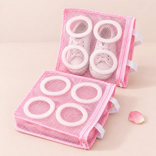 RosyIron shoe wash bags, two pink mesh bags with white foam rings, one holding small white sneakers