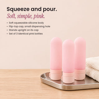 RosyIron three pink silicone travel bottles on a silver tray with soft body and flip-top caps
