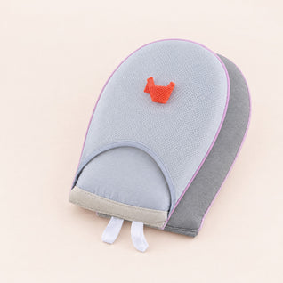 RosyIron steamer glove, a grey padded ironing mitt with mesh pocket and orange finger strap, on blush-cream backdrop