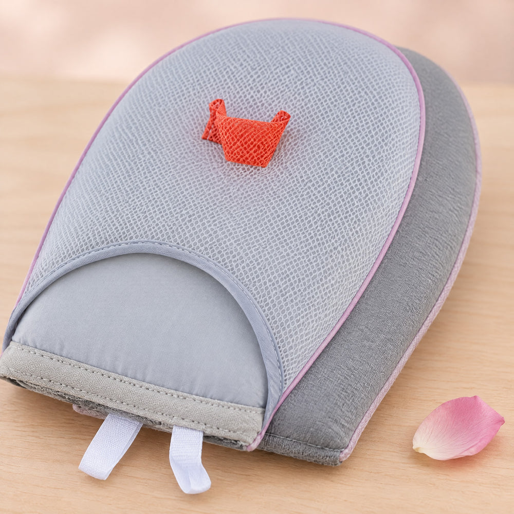 RosyIron ironing glove close-up showing mesh hand pocket, orange finger strap, padded edge and grey back panel