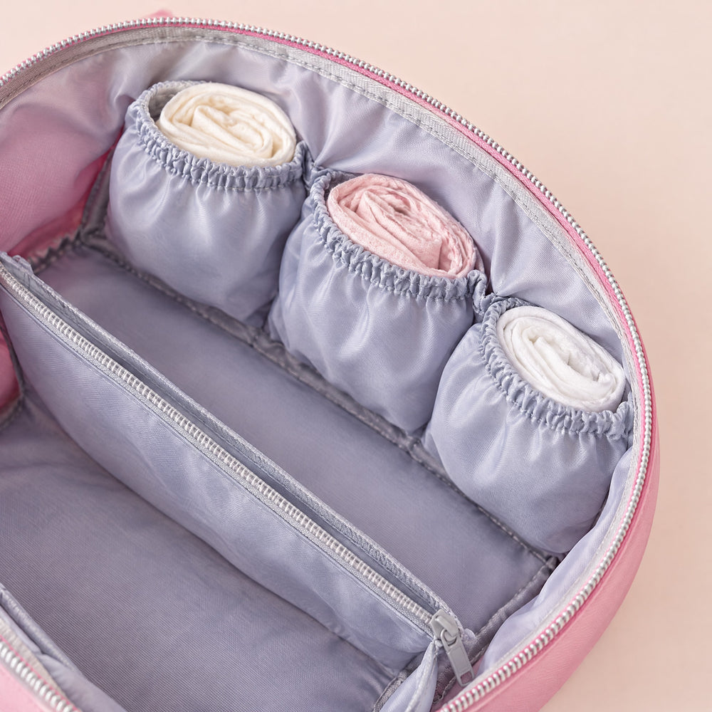 RosyIron lingerie pouch interior with grey lining, elastic pockets holding rolled underwear and zippered divider