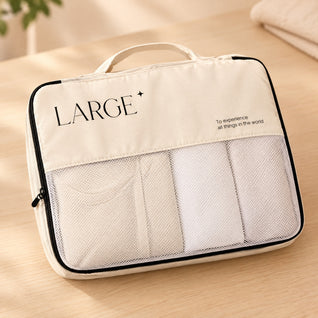 RosyIron large cream packing cube close-up showing white mesh panel, black zipper trim and top handle
