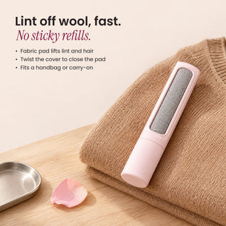 RosyIron pink lint brush resting on a folded camel wool sweater, with benefits: no sticky refills, twist cover